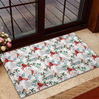 White rubber Christmas doormat with red cardinal birds and green berry sprig pattern