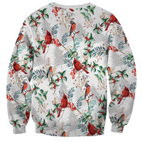 Unisex crewneck sweatshirt in white with cardinal, holly, and leaf pattern, long sleeves