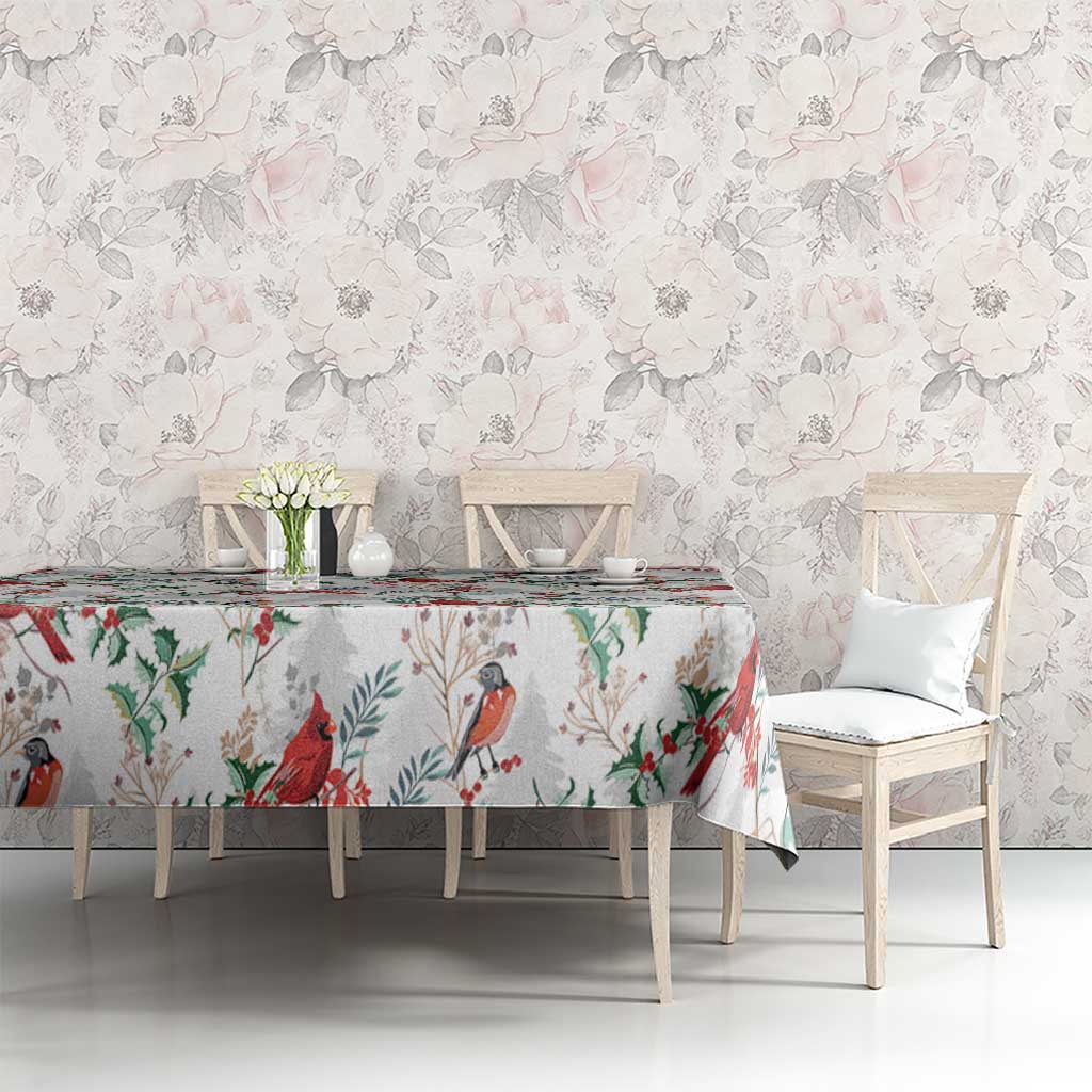 White tablecloth with red cardinal bird and green leaf pattern, on dining table
