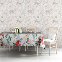 White tablecloth with red cardinal bird and green leaf pattern, on dining table