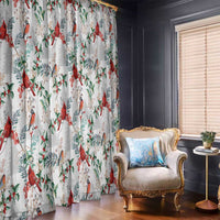 White cardinal-themed Christmas curtain with red birds, green leaves, and scattered branches