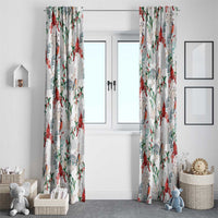 Pair of white Christmas curtains with red birds and green leaves pattern framing a doorway