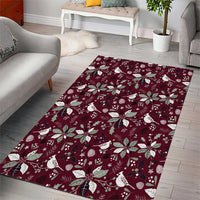 Wine red holiday area rug with white poinsettia and bird motif
