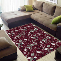 Wine red area rug with scattered white poinsettias and bird silhouettes
