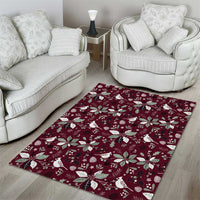 Wine red Christmas area rug with white poinsettias, holly leaves, and birds