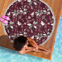 Round wine-red beach blanket with white birds, holly, and star pattern; fringed border