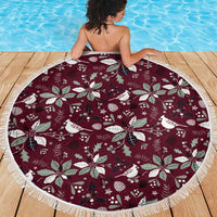 Round wine-red Christmas beach blanket with white birds and foliage print, tassel-fringe edge