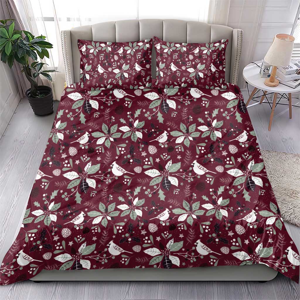 Deep red duvet cover with white bird and poinsettia holiday pattern plus matching pillow shams