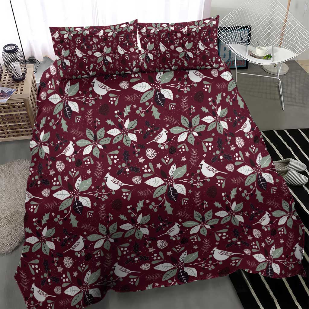 Deep red holiday bedding set with white bird, wreath and poinsettia pattern on duvet and shams