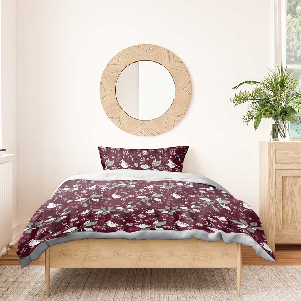 Deep red Christmas duvet cover with white bird and poinsettia pattern and matching pillow cover