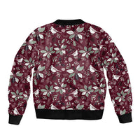 Wine red bomber jacket back with Christmas bird-and-flower pattern; black ribbed hem