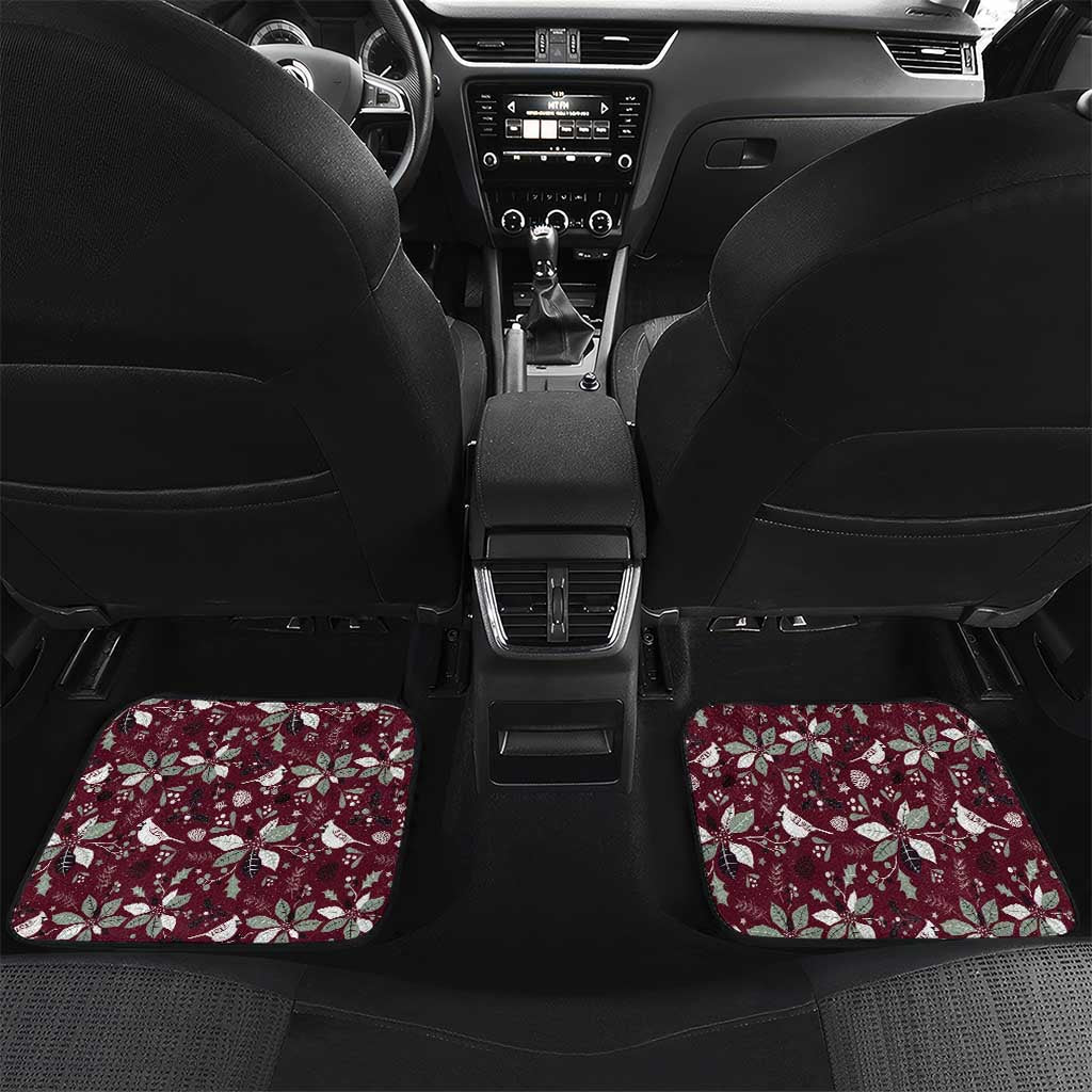 Wine red rear car floor mats with Christmas motif, laid across the back seat area