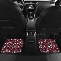 Wine red rear car floor mats with Christmas motif, laid across the back seat area
