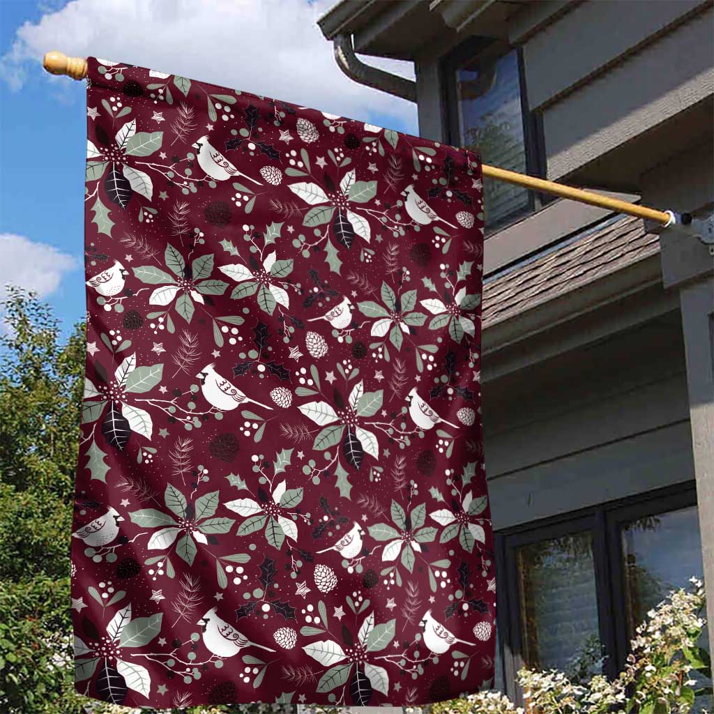 Wine red garden flag on a pole with white poinsettias and birds pattern