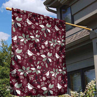 Wine red garden flag on a pole with white poinsettias and birds pattern
