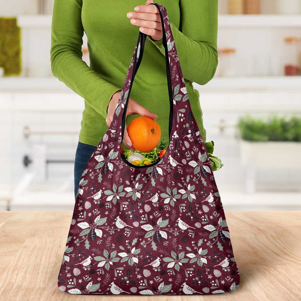 Wine red holiday tote bag with white botanical pattern and produce inside through open top