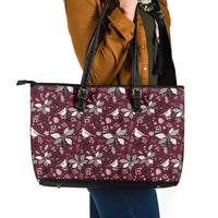 Wine-red leather tote bag with holiday bird print, double black handles and front straps