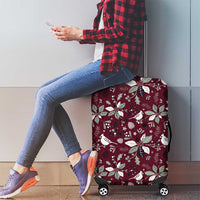 Wine red luggage cover with poinsettia and bird pattern, fitted case over rolling wheels