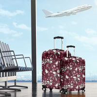 Wine red luggage cover set with poinsettia and bird holiday pattern on two wheeled suitcases