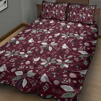 Wine red quilt bed set with holly leaf, flower, bird, and star pattern on bed with shams