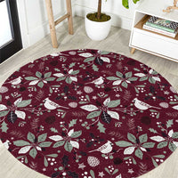 Wine red round carpet with white Christmas bird, poinsettia and leaf pattern