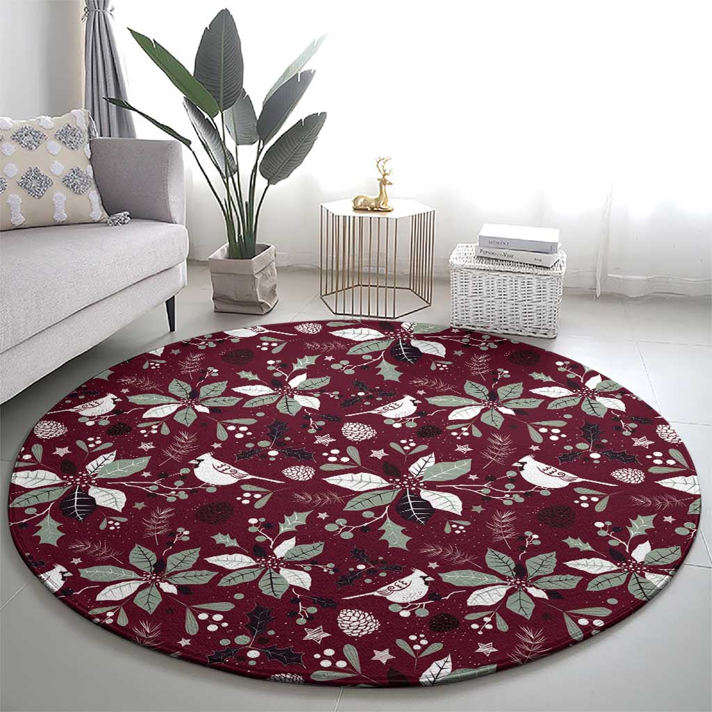 Wine red round carpet with scattered white poinsettias, leaves, and bird figures