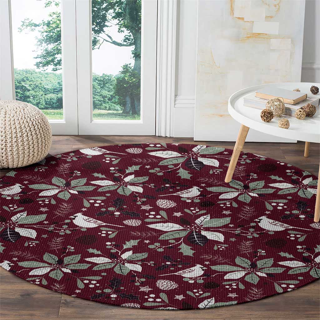 Wine red round carpet with white bird and poinsettia pattern, full surface view