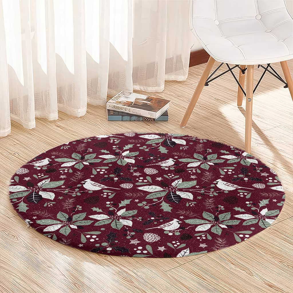 Wine red round rug with white festive bird, leaf, and star print