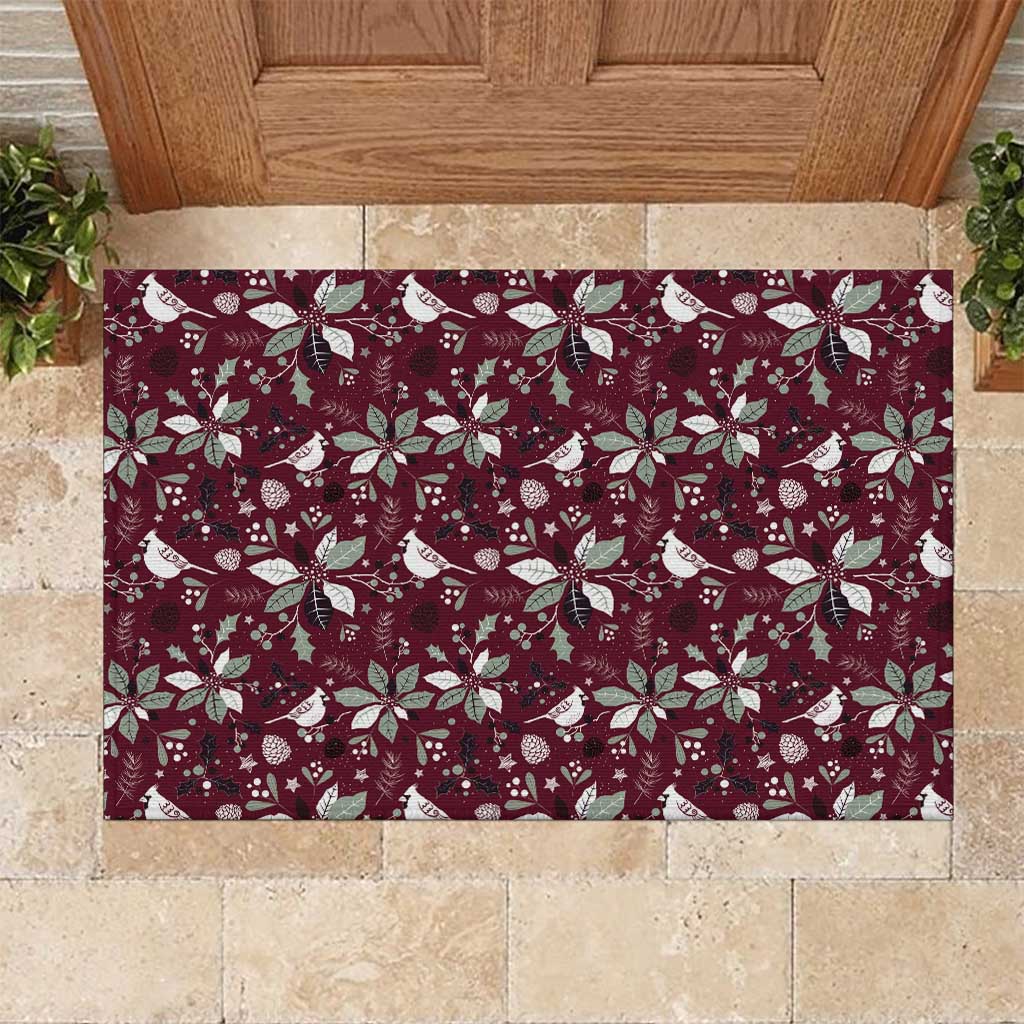Wine red rubber doormat with festive birds, poinsettias, and snowflake pattern