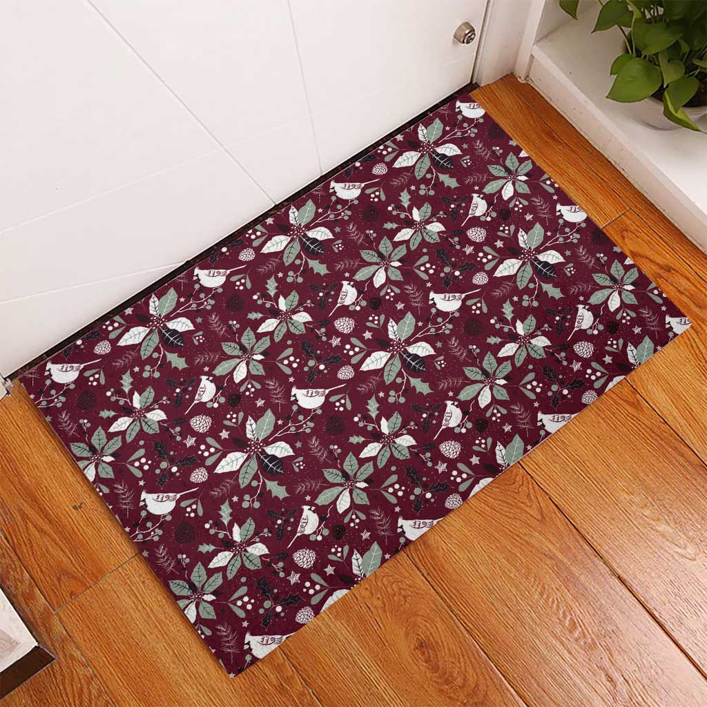 Wine red rubber doormat with holiday bird and poinsettia pattern, corner view