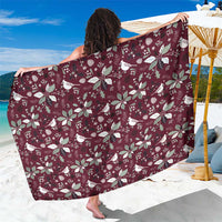 Wine-red holiday floral patterned sarong wrap, held out wide