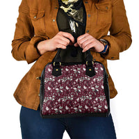 Wine red floral handbag with black top handles and front pocket