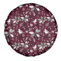 Maroon spare tire cover with white poinsettia, leaf, and bird print, round design