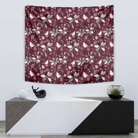 Christmas tapestry in wine-red with repeating bird and poinsettia pattern