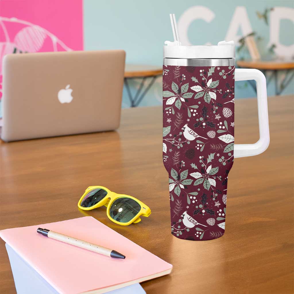 Wine red Christmas tumbler with white handle, clear straw, and festive pattern
