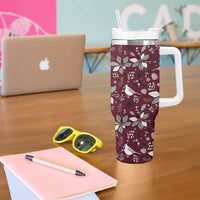 Wine red Christmas tumbler with white handle, clear straw, and festive pattern
