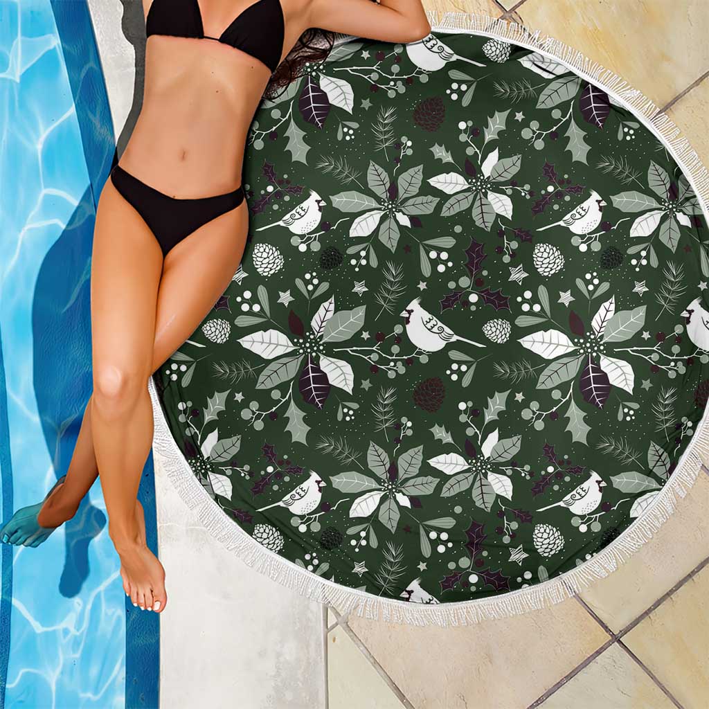 Round green beach blanket with festive bird-and-leaf print and white fringed trim