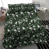 Green duvet cover bedding set with repeating leaf, bird, and berry motif