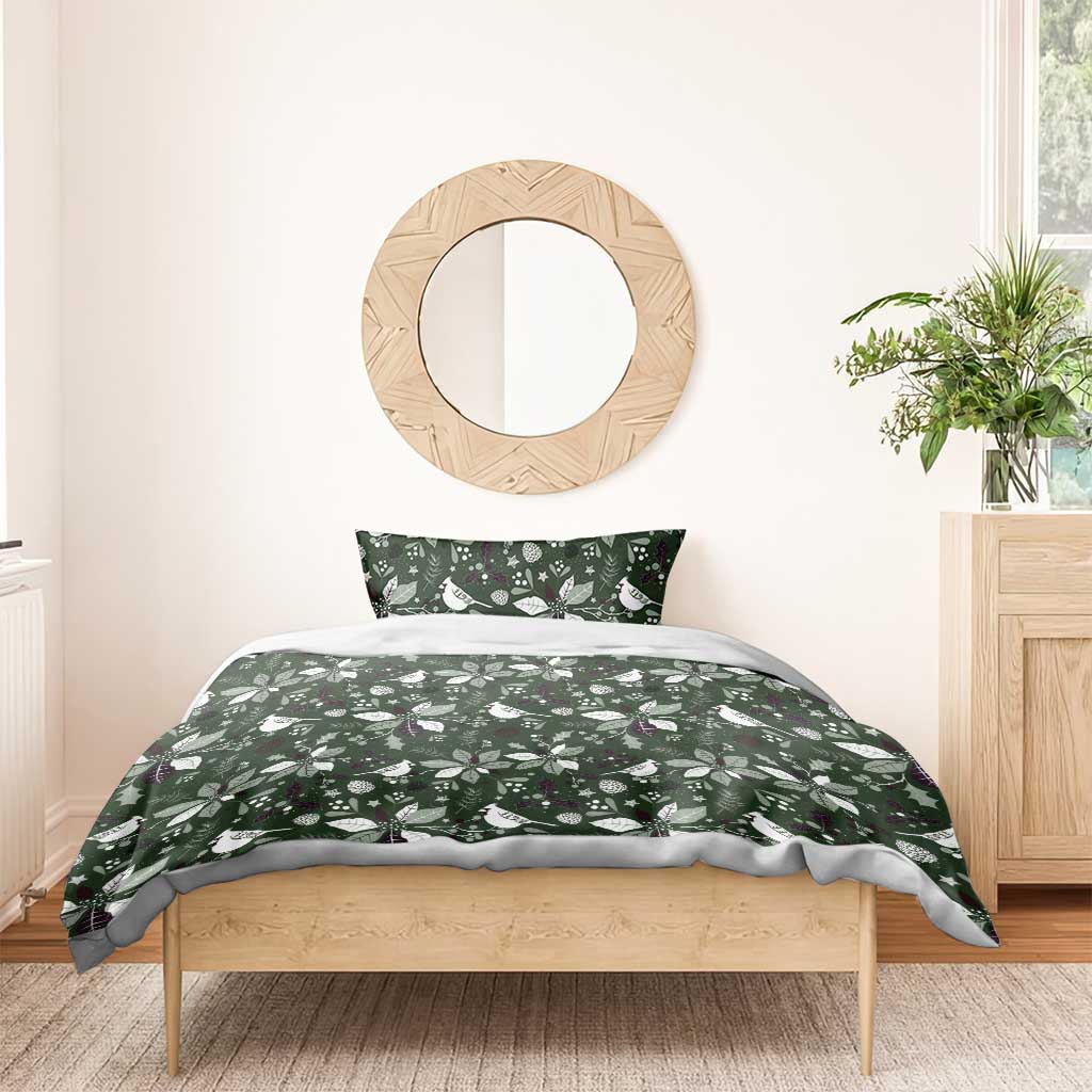 Green duvet cover bedding set with Christmas leaf and bird pattern, bed front view