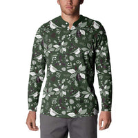 Green button sweatshirt with Christmas leaf and bird pattern, worn by man