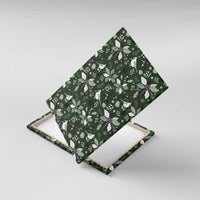 Green Christmas canvas wall art close-up with bird and foliage pattern, angled.