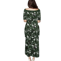 Green long dress with holiday print, back view, boat neckline, short sleeves