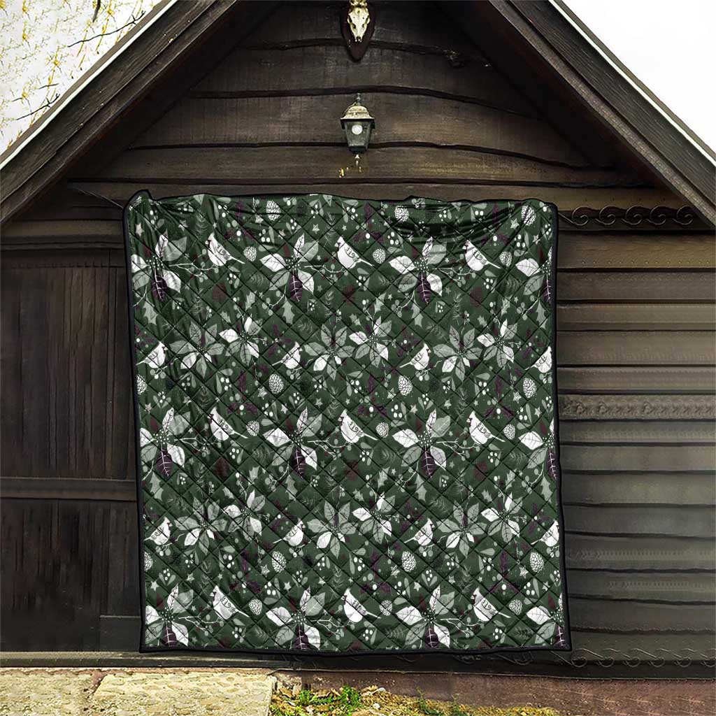 Green Christmas quilt panel with white Christmas motifs and dark binding, corner hem