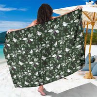 Green Christmas sarong with white bird and leaf pattern, wrapped knee-length skirt.