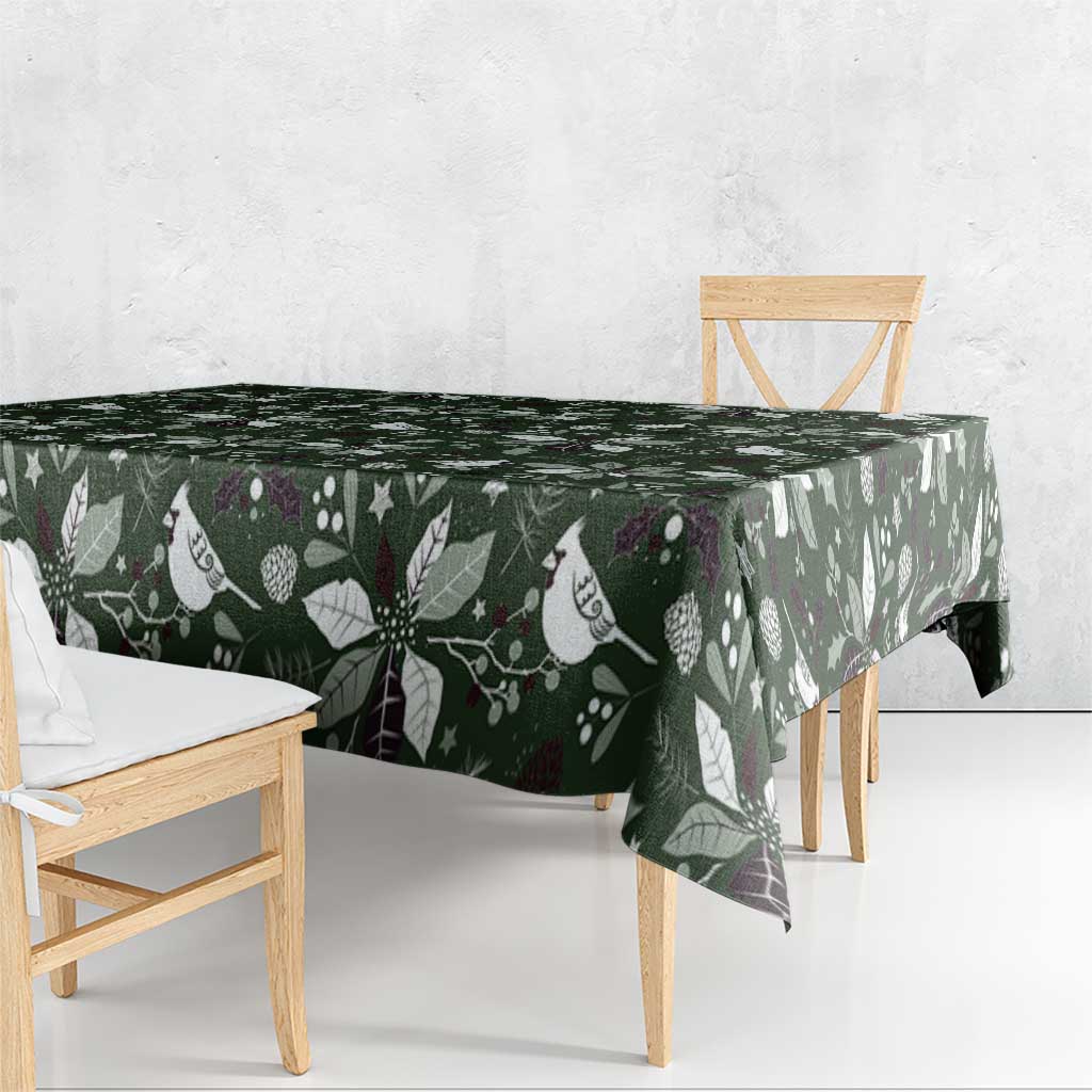 Green Christmas tablecloth with bird and leaf pattern, front corner overhang.