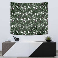 Green Christmas tapestry with repeating bird, leaf, and flower design, rectangular wall hanging