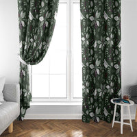 Green window curtain panels with white bird and leaf seasonal pattern, tied at side