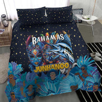 Blue bedding set featuring star pillowcases and large Junkanoo mask graphic duvet