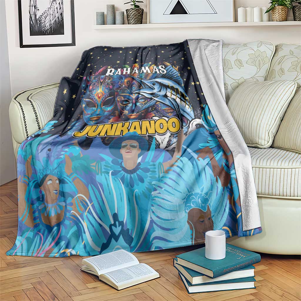 Blue throw blanket with star pattern and colorful Junkanoo mask and dancer artwork