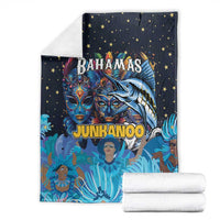 Folded navy blue blanket with Bahamas Junkanoo print, star pattern, and matching stacked towels
